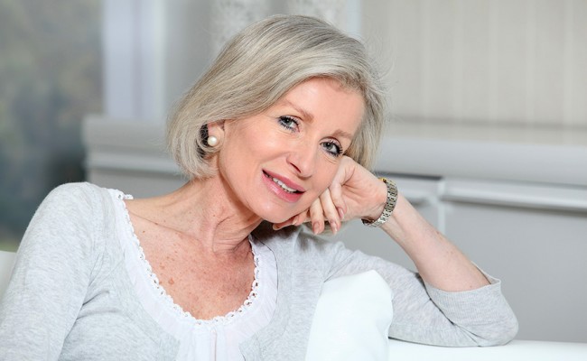 Closeup of smiling senior woman relaxing at home